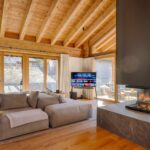 002 Penthouse Weissmatten sofa and fireplace